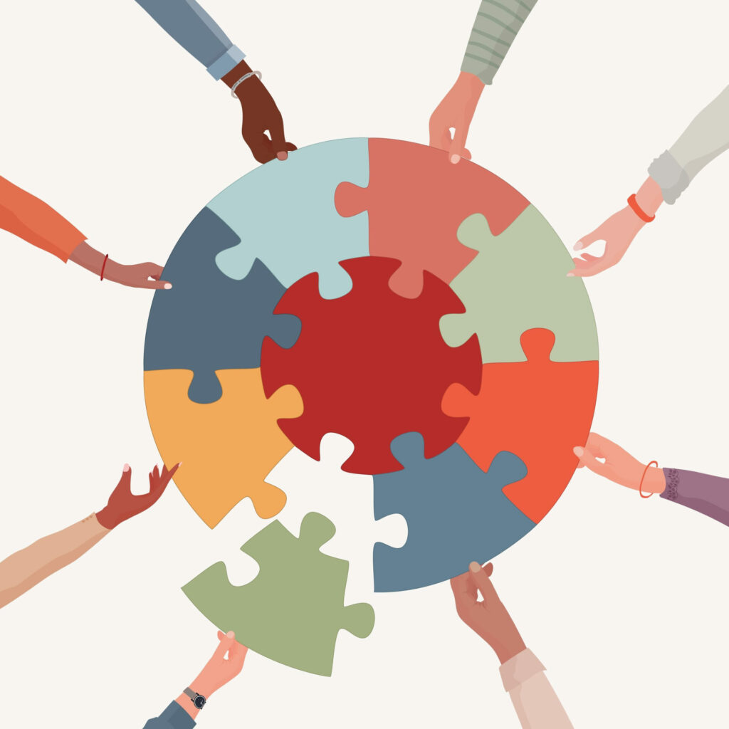 Illustration of diverse hands putting together puzzle pieces that make a circle.