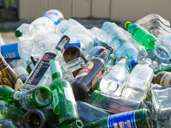pile of plastic and glass bottles