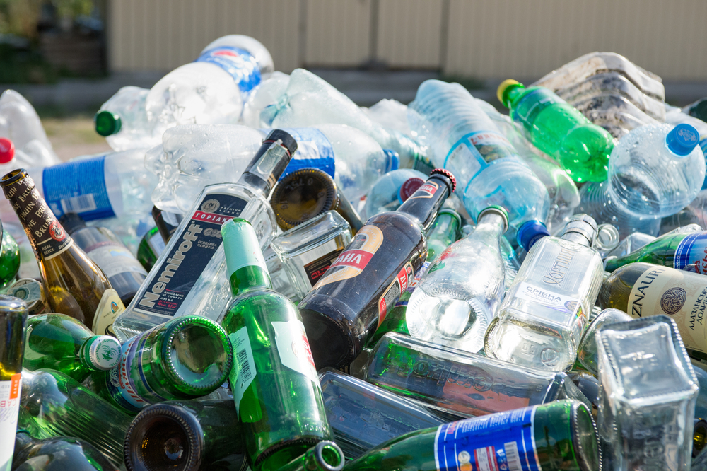 pile of plastic and glass bottles